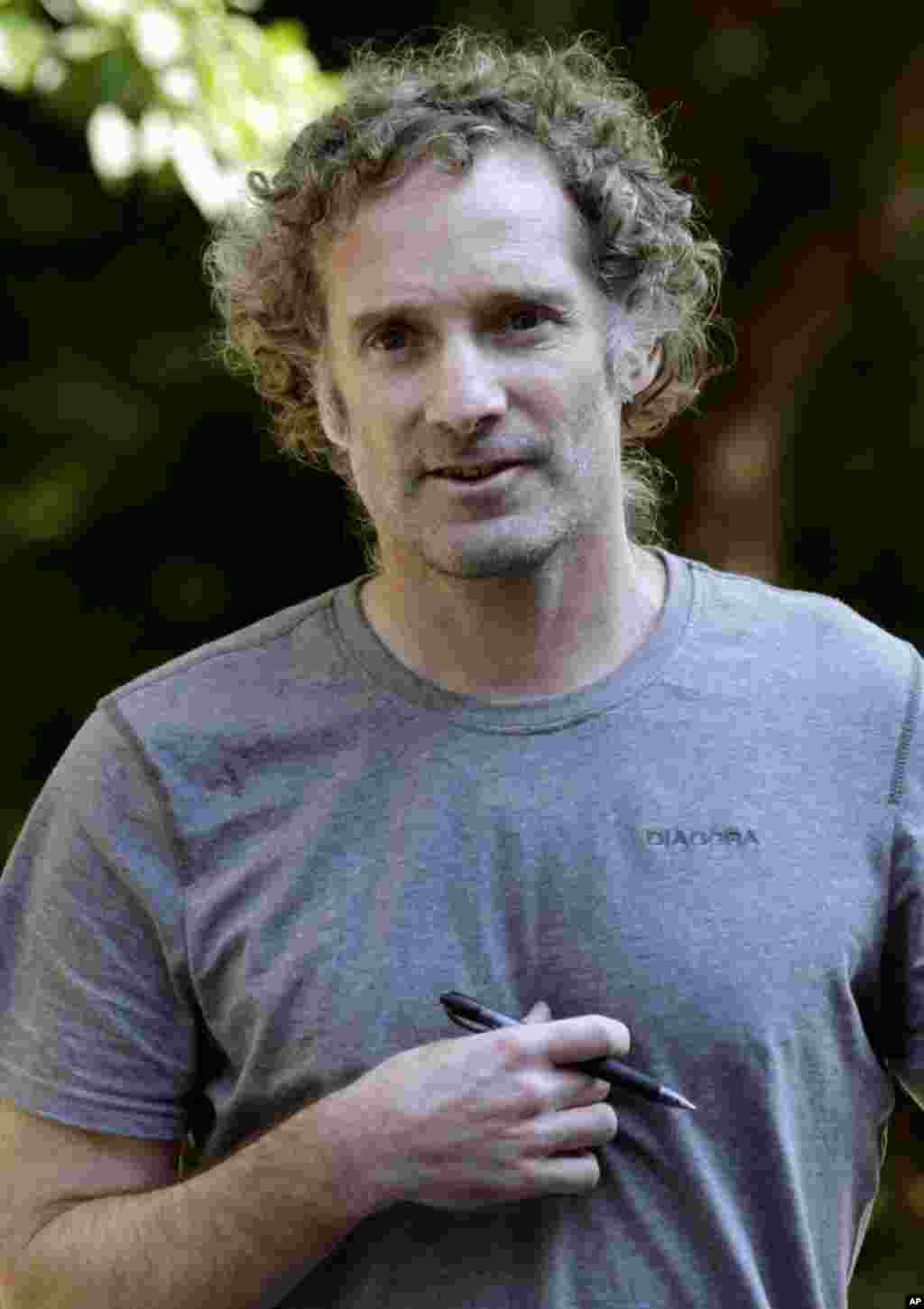 Peter Theo Curtis walks toward reporters to read a statement outside his mother's home in Cambridge, Massachusetts, Aug. 27, 2014. 