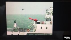 日本海上保安厅公开5月18日在钓鱼岛附近海域拍摄到中国海警船放飞疑似小型无人机的录像(截图)