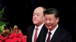 中国国家主席习近平与新任澳门行政长官贺一诚在澳门抵达就职仪式会场。(2019年12月20日)