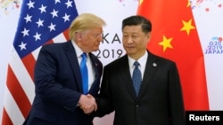 资料照:美国总统特朗普和中国领导人习近平在日本大阪出席G20领导人峰会期间举行会晤。(2019年6月29日)