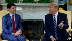 资料照片:加拿大总理特鲁多与美国总统特朗普 (2019年6月20号摄)