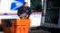 FILE - A U.S. Postal Service employee loads parcels outside a post office in Wheeling, Ill., Jan. 29, 2024. 