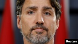 加拿大总理特鲁多1月11日在渥太华举行记者会,要求伊朗承担全部责任。