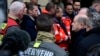 German Chancellor Olaf Scholz (R) talks to rescuers during a visit to the site of a car-ramming attack on a Christmas market in Magdeburg, eastern Germany, on December 21, 2024, resulting in several deaths and dozens of injured.