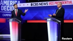 2024年10月1日晚上,美国共和党副总统候选人JD万斯(左)和民主党副总统候选人蒂姆·沃尔兹在辩论会上。