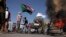 Sudan protesters - burnt tires tyres burned - smoke - fire - barricade Khartoum