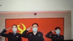 中国公安部副部长孙力军与火线入党的武汉抗疫一线女警察 (推特截图)
