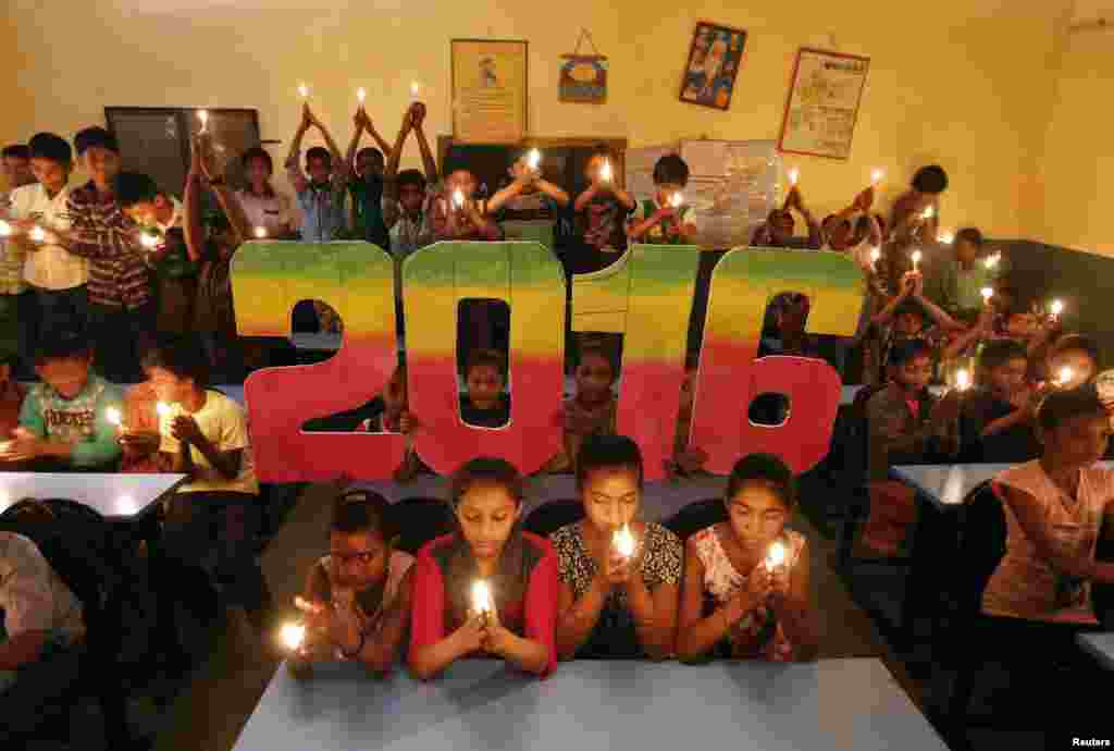 Indonesian children in costumes gather during a parade for this year's last sundown in Bali island, Dec. 31, 2015.