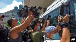 资料照片：香港新闻工作者进行拍摄工作。