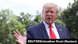 美国总统特朗普离开白宫前往佛罗里达州奥兰多开启竞选活动前,接受记者采访。(2019年6月18日)。