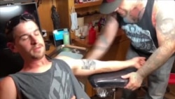 抗议引发人们祛除种族主义纹身 抗议引发人们祛除种族主义纹身