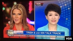 福克斯商业频道主持人翠西·里根2019年5月30日与中国环球电视网(CGTN)主播刘欣对话(美国之音许宁拍摄电视画面)