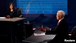 美国两大政党副总统候选人2020年10月7日晚首次直面辩论(路透社转发媒体联访照片)