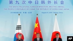中日韩三国外长联合记者会。(2019年8月21日)