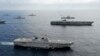 Tàu sân bay USS George Washington, tàu đổ bộ JS Hyuga cùng với các tàu khác của Hải quân Mỹ trong một cuộc tập trận hải quân ở Biển Hoa Đông.