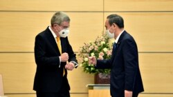 国际奥委会主席巴赫2020年11月16日在东京会见日本首相菅义伟(路透社)