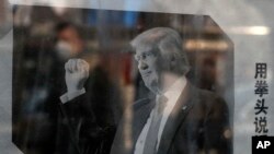 Riot police fire tear gas at students protesting a new law they say has crippled the country's anti-corruption agency, during a clash outside parliament in Jakarta, Indonesia.