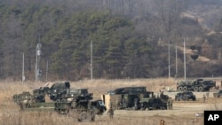 FILE - U.S. Army armored vehicles are seen during a military exercise in Yeoncheon, South Korea, near the border with North Korea, South Korea, Feb. 27, 2019.