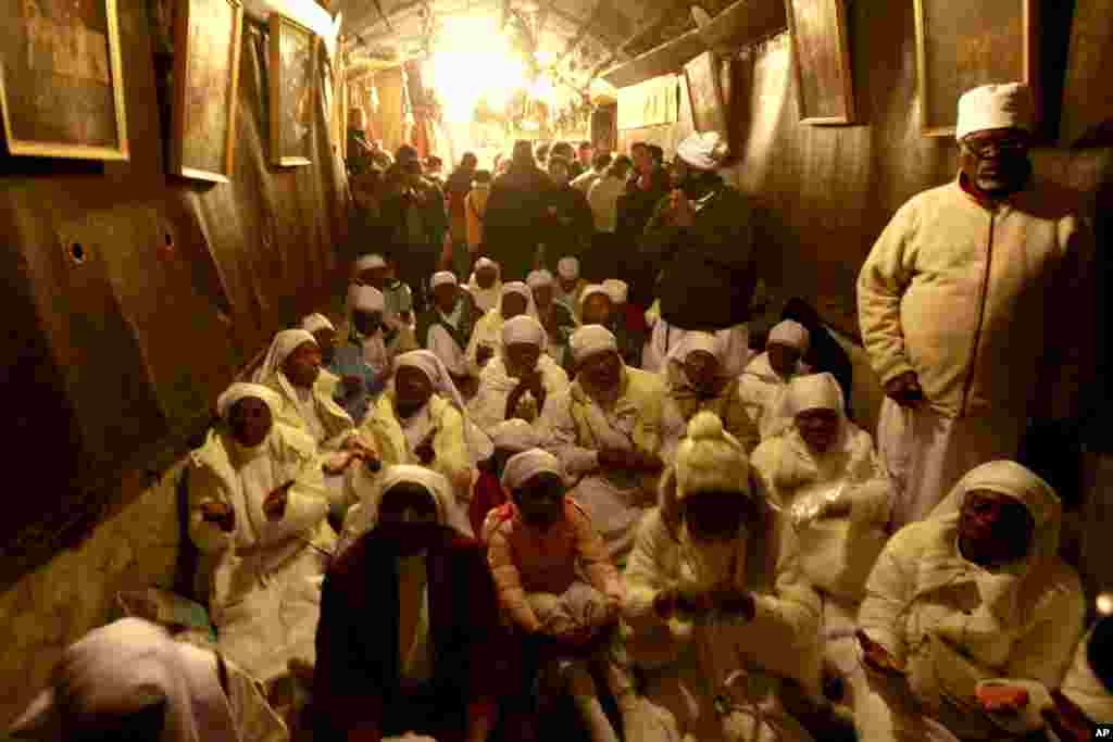 Christian worshippers from Nigeria pray at the Church of Nativity in the West Bank town of Bethlehem on Christmas Eve, Dec. 24, 2013.