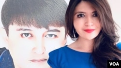 资料照:大西洋理事会高级研究员莱汉·阿萨特(Rayhan Asat)和她的兄弟。