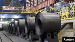 FILE - Rolled steel is seen after being treated on the pickle line at the Severstal steel mill in Dearborn, Michigan, June 21, 2012.