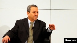 A woman tries out a swing in front of a screen featuring New York scene during the new Air France Exhibition called "Air France, France is in the Air" in New York.