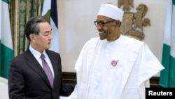 资料照片:尼日利亚总统布哈里与到访的中国外长王毅会谈(2017年1月11日)