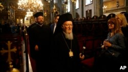 Ecumenical Patriarch Bartholomew I, the spiritual leader of the world's Orthodox Christians, leaves the Patriarchal Church of St. George, following Sunday services in Istanbul, Oct. 7, 2018.