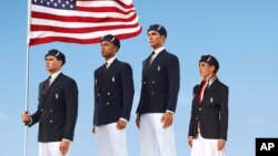 Employees of Cochin Shipyard stand beside India's Indigenous Aircraft Carrier P-71 'Vikrant' built for the Indian Navy during its launch in the southern Indian city of Kochi, India.