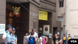 People wait outside a mosque in central Christchurch, New Zealand, March 15, 2019.