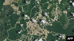 Dalam citra satelit Earth Observatory NASA yang diabadikan pada Februari 2024 ini, terlihat pemandangan kemajuan lokasi pembangunan IKN. (Foto: NASA Earth Observatory/AFP)