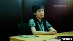 谷开来,2013年8月10日济南中级法院视频截屏。8月23日济南法院在薄熙来审判庭上展示该截屏