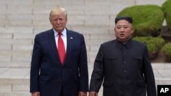 U.S. President Donald Trump meets with North Korean leader Kim Jong Un at the North Korean side of the border at the village of Panmunjom in the Demilitarized Zone, June 30, 2019.
