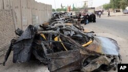 Hiện trường vụ nổ bom xe tại khu vực Shula ở thủ đô Baghdad, ngày 12/10/2014.