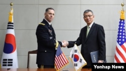Women dressed in the traditional clothes of the Sorbs carry the statue of Virgin Mary during a procession in the church in Rosenthal, Germany.