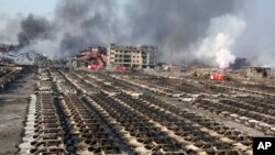 天津发生大爆炸后的现场。2015年8月12日,天津市滨海新区天津港的瑞海国际物流中心货柜码头集装箱内易燃易爆品连串爆炸