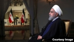 资料照: 伊朗总统鲁哈尼。2018年8月6日