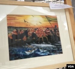 2017年9月3日,美国首府华盛顿叙利亚节庆现场展出画作,卡瓦.阿布德.阿尔阿济兹.哈吉.马捷德作品 (美国之音扬之初摄)