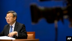 中国商务部副部长王受文2018年6月28日参加新闻发布会,就最新发表的《中国与世界贸易组织》白皮书介绍情况(美联社)