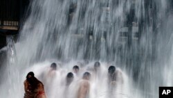 People cool off at the water park during the "Circuit" the international gay festival in Vilassar de Dalt, Spain, Aug. 9, 2016.