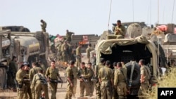 2023年10月11日，以色列军队士兵部署在以色列南部加沙边境附近的一个阵地。（法新社照片）