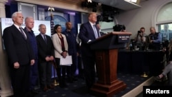 FILE - U.S. President Donald Trump takes questions from reporters during a briefing with members of the coronavirus disease (COVID-19) task force at the White House in Washington, March 16, 2020.