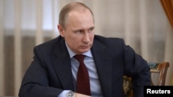 3月27日俄罗斯总统普京在莫斯科郊外主持一个会议