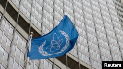 FILE - The flag of the International Atomic Energy Agency flies in front of its headquarters in Vienna, Austria, Jan.15, 2016.