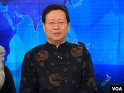 旅美经济学者夏业良