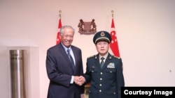 新加坡防长黄永宏与中国防长魏凤和2018年10月18日会面(黄永宏推特照片)