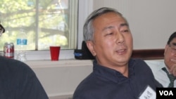 资料照片:时任民运团体民主中国阵线副主席的唐元隽在纽约参加一次讨论中国政局的研讨会。 (2015年9月19日)。