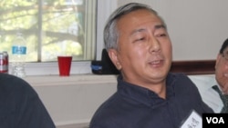 资料照片:时任民运团体民主中国阵线副主席的唐元隽在纽约参加一次讨论中国政局的研讨会。 (2015年9月19日)。