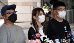 资料照:前香港众志秘书长黄之锋黃(右)、前成員周庭(中)、前主席林朗彥