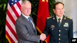 Ukrainian soldiers on an armored personnel carrier pass by people carrying their belongings as they flee the conflict, in the Vyshgorod region close to Kyiv, March 10, 2022. Russia’s two-week-long war in Ukraine has killed thousands of people and forced more than 2 million others to flee the country, shaking the foundations of European security.